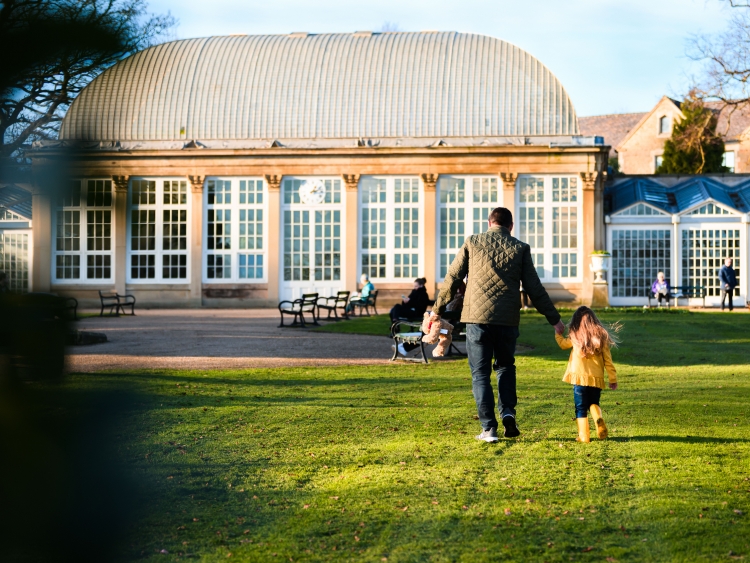 Dad and girl in gardens