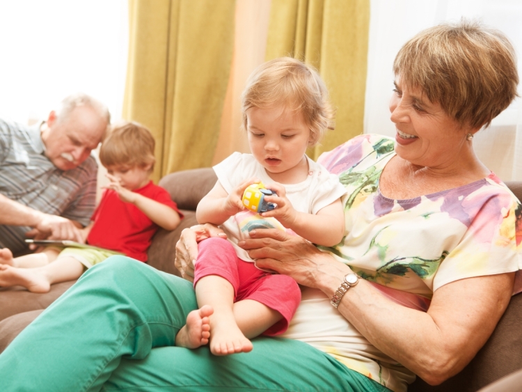 Grandparents playing with their grand children